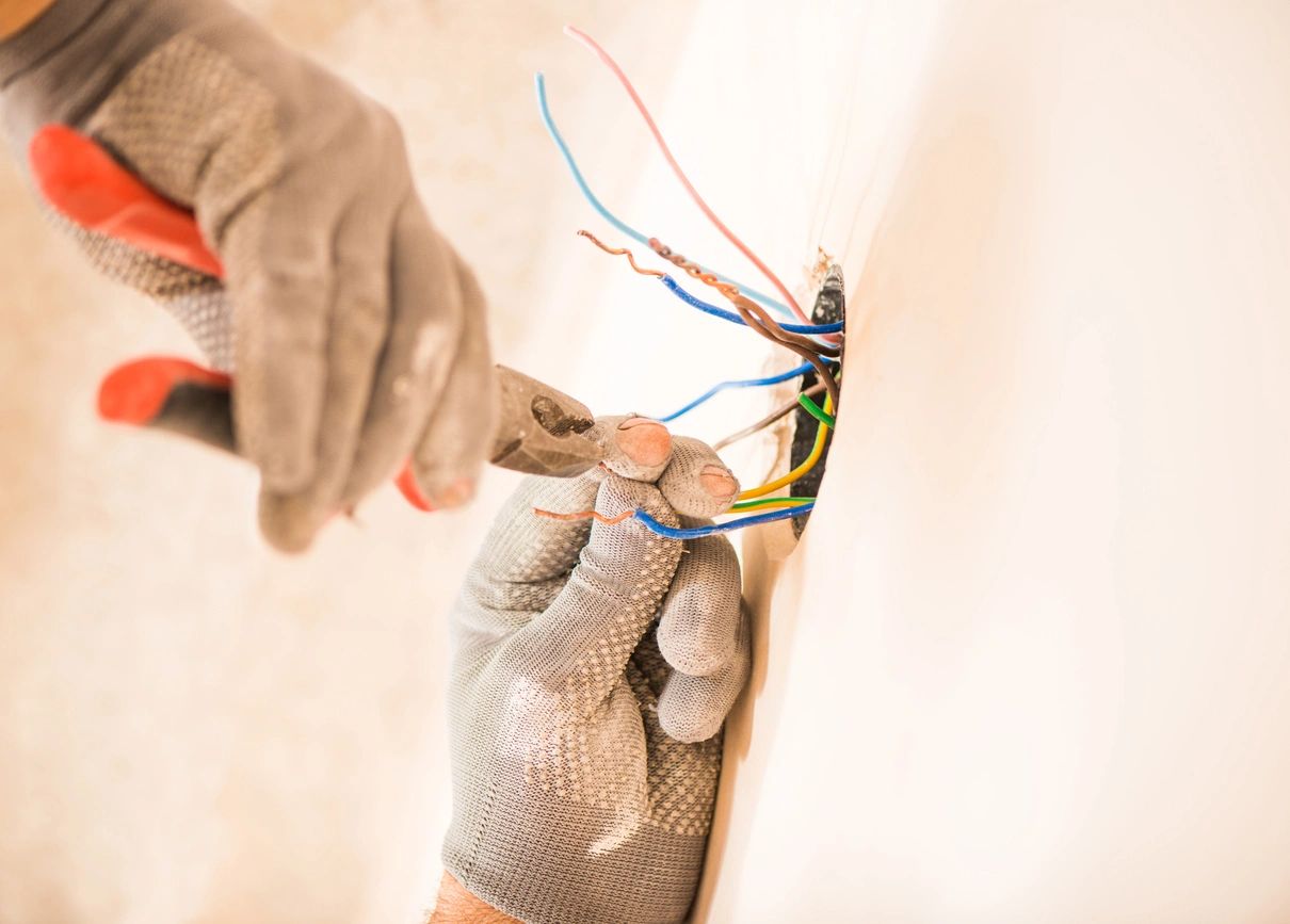 Worker installing electrical wires