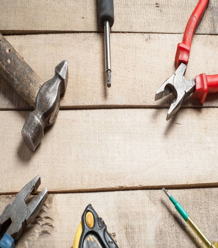 Tools on wooden background